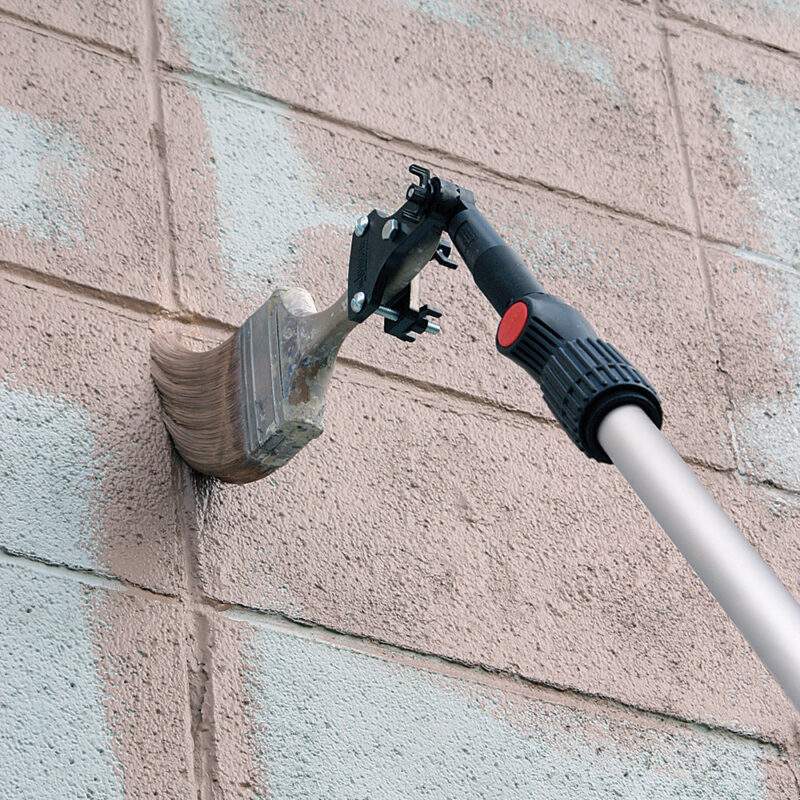 Closeup of Brush holder painting an exterior building