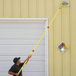 Triple Reach bulb changer combo changing an industrial floodlight