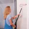 Painting a wall with the TeleRoller paint roller extension pole.