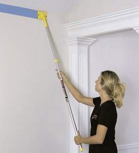 Edging near the ceiling using an extension pole.