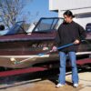 Angle adaptor adjusts brush for cleaning a boat hull