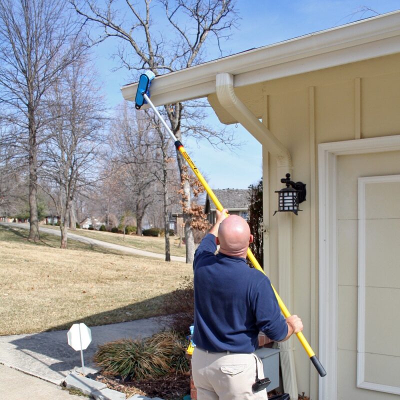 Cleaning gutters with the soft brush and Alumiglass extension pole