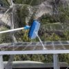 Soft flow-thru brush rinsing off solar panel