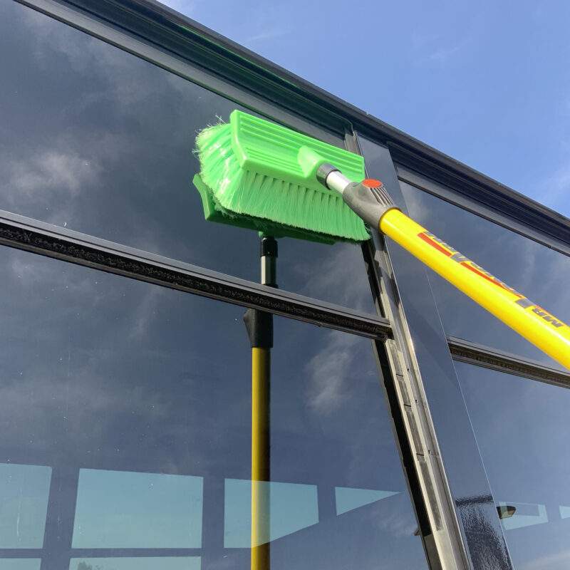 Closeup of very soft bi-level brush cleaning bus windows