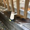 Cleaning under a rail with TeleWash flow-thru cleaning brush.