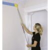 Painting against the ceiling with the trim smart paint edger on an extension pole