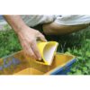 Contour stain applicator being loaded with stain