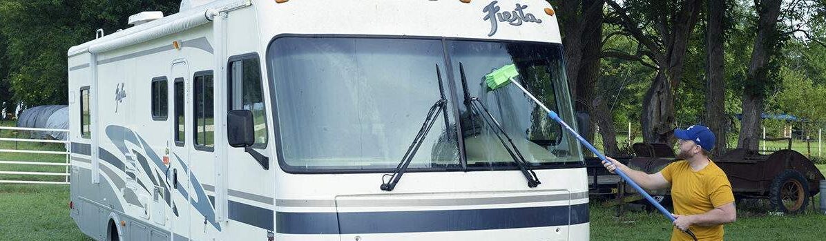 RVCategory Cleaning an RV windshield with the green bi-level brush