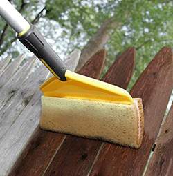 Flexcore Stain Applicator staining a fence.