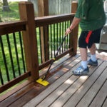Staining a deck with the 9 inch standard stain applicator.