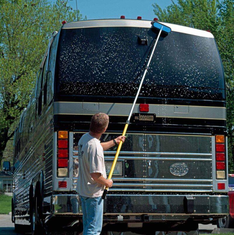 Cleaning MLA bus with blue brush.