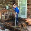 Cleaning a deck with the TeleWash flow-thru cleaning brush.