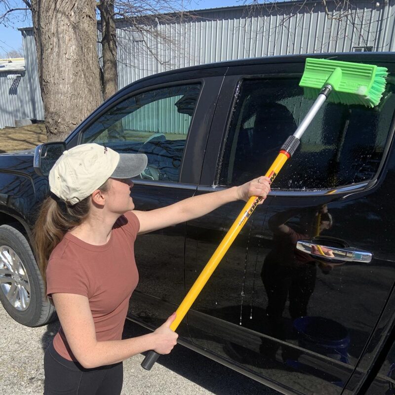 telescoping extension pole washing a vehicle with a brush