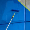 Painting a parking garage with a Smart-Lok extension pole.