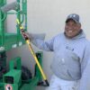 Smiling Contractor holding a 3-6 ft Smart-Lok extension pole.
