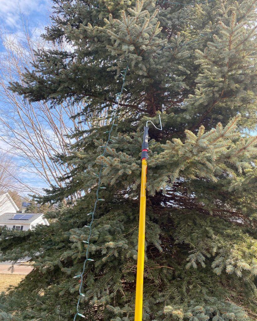 Christmas light hanging online pole for trees