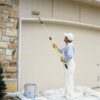 Man painting with Super Tab-Lok paint pole